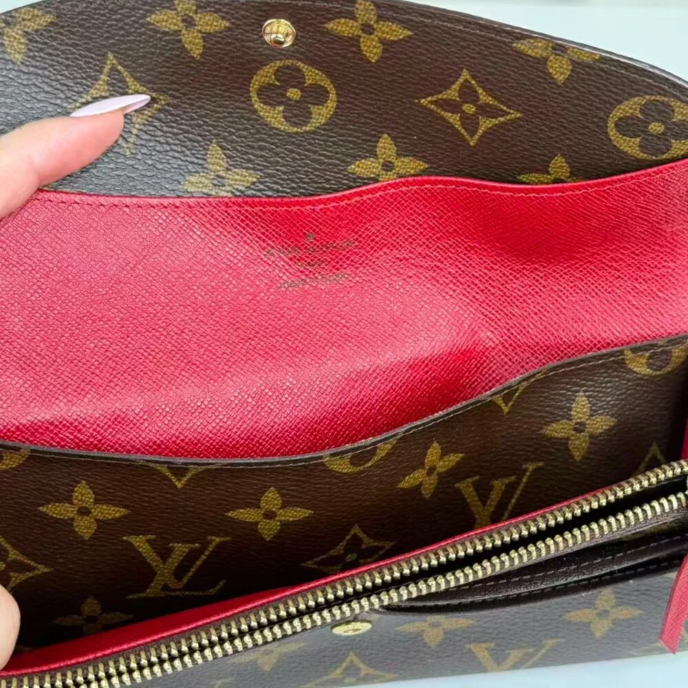 Louis Vuitton Monogram Canvas Wallet with Classic Design and Red Pin Detail